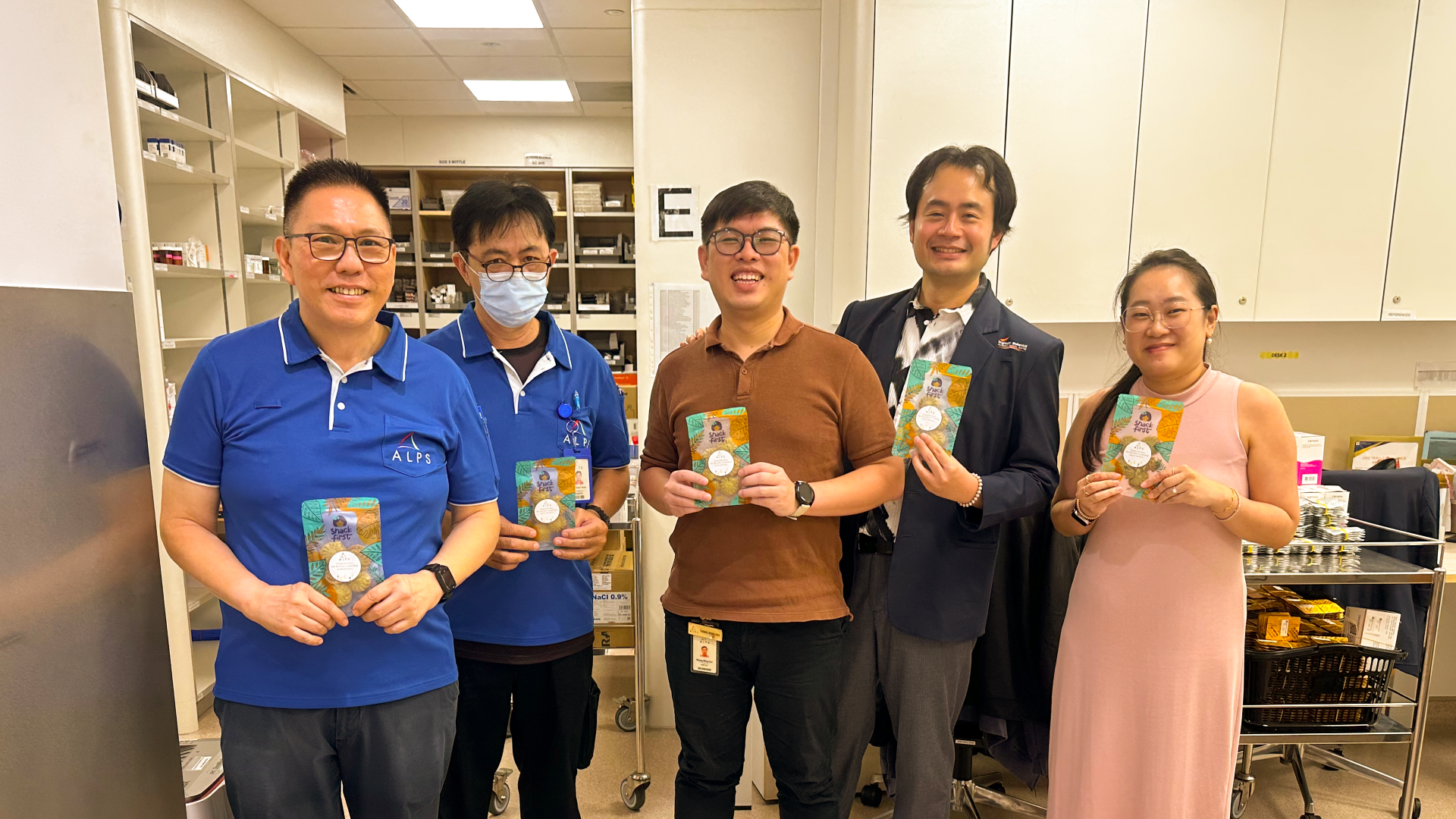 Image of ALPS staff with their Hari Raya festive goodies 